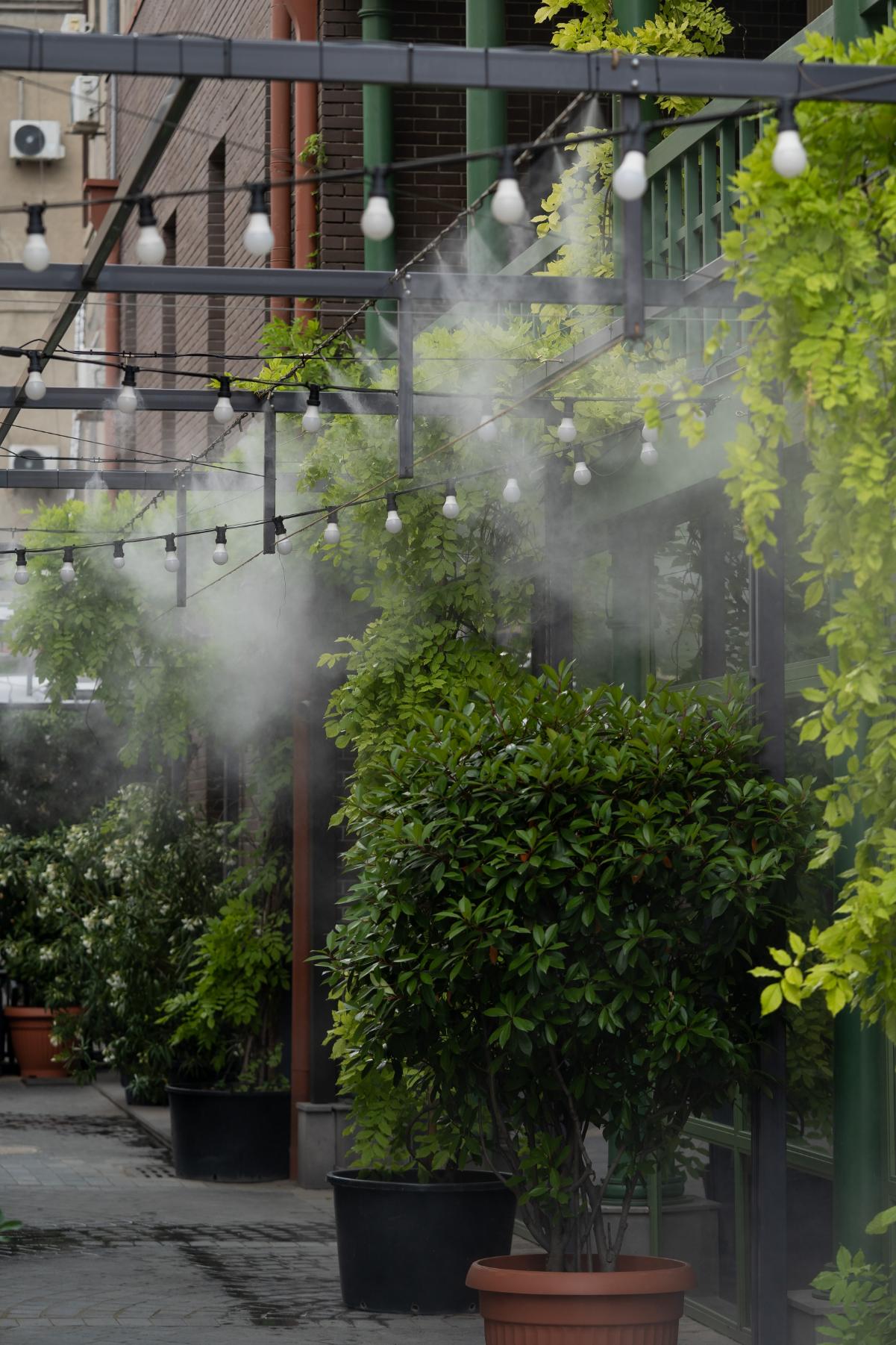 Automatic water spray system create cooling effect hot weather plants people