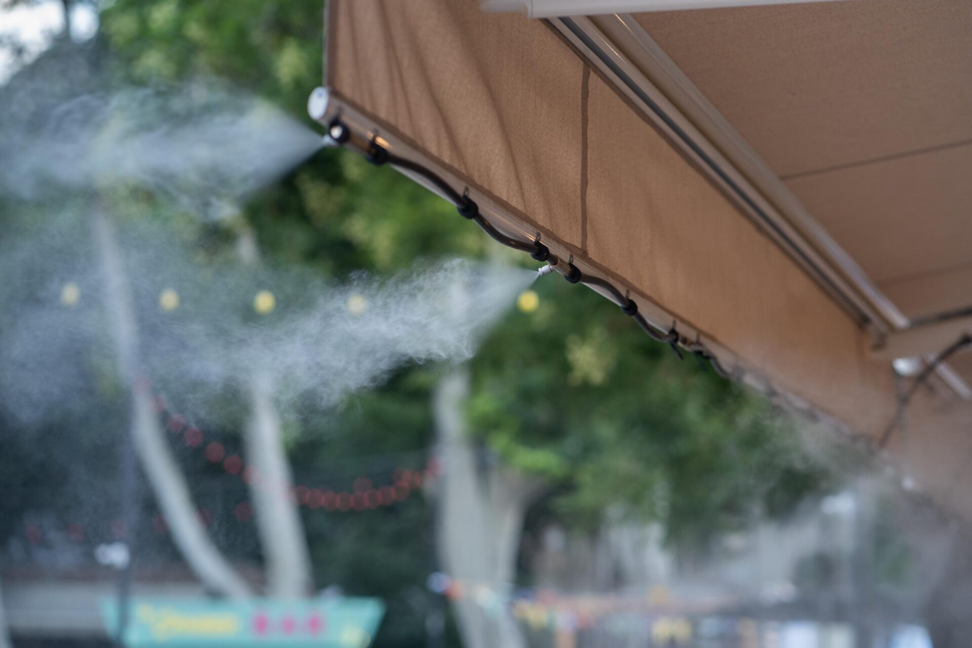 Facility that lowers temperature by spraying water water fog machine working hot summer day